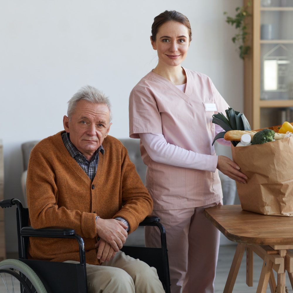 portrait-of-disabled-senior-man-with-female-caregiver.jpg